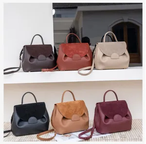 Detail view of women genuine leather top-handle shoulder messenger bag in multiple chic colors.