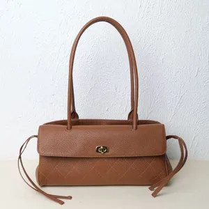 Brown genuine leather shoulder bag for women, retro quilted baguette tote with top handle and lock.