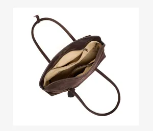 Brown suede pillow shoulder bag detail, showing interior compartments and durable straps.
