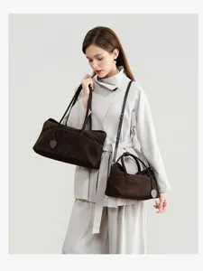 Suede pillow bag detail view, brown retro underarm tote and crossbody bag display.