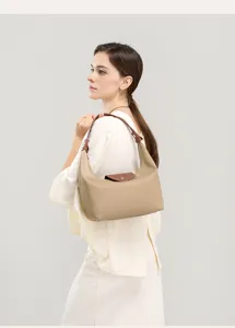 Beige nylon shoulder bag with brown leather flap, classic underarm hobo style for women