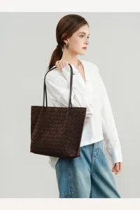 Detailed view of the stylish brown woven suede tote bag showcasing exquisite craft.