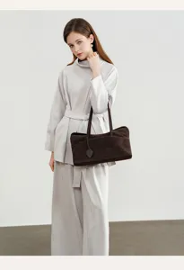 Brown suede shoulder bag, vintage pillow tote design for women, ideal for daily commuting.