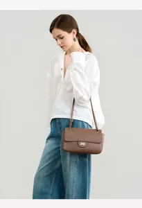 Genuine leather shoulder bag for women, stylish brown commuter crossbody underarm bag with flap.