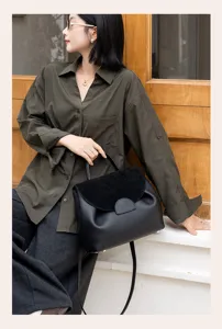 Elegant genuine leather shoulder bag for women, stylish commuting handbag with top handle.