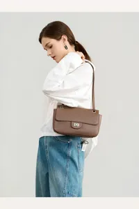 Genuine leather shoulder bag for women, stylish commuting flap bag with turn lock design.