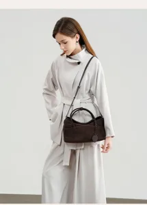 Retro brown suede pillow bag, stylish versatile crossbody and shoulder bag for women.