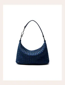Close-up detail of luxury woven leather hobo shoulder bag in dark blue with metallic link.