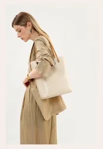 Chic beige woven leather tote bag for women, large capacity vintage shoulder handbag style.
