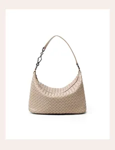Close-up detail of the elegant women's genuine leather woven shoulder hobo handbag.