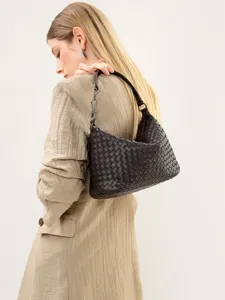 Woven leather shoulder bag for women, elegant dark brown hobo underarm handbag for daily wear.