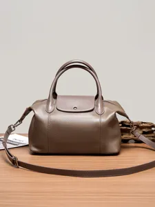 Genuine leather pillow shoulder bag, elegant top handle crossbody handbag for daily use.