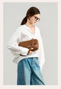 Brown genuine leather shoulder bag, chic commute crossbody bag for women, stylish design.
