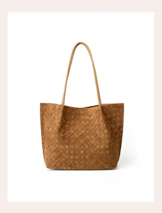 Detailed view of the brown woven leather tote bag showcasing exquisite craftsmanship and large capacity.