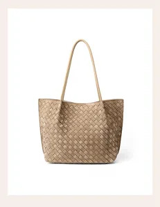 Detail view of the elegant woven suede tote shoulder bag, showcasing fine craftsmanship.