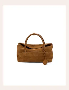 Brown suede women pillow bag detail view, retro shoulder bag for daily commuting stylish.