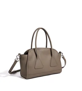 Vue détaillée du sac à main en cuir de qualité, élégant sac boston aux poignées stylées.