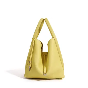 Minimalist yellow leather bucket bag, chic top handle handbag for women daily commute style.