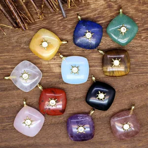 Natural gemstone rhombus crystal pendant with golden sunburst design for DIY jewelry making.