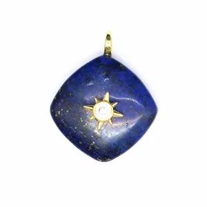 Natural lapis lazuli rhombus crystal pendant detail featuring a gold sun star design.