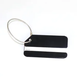 Close-up detail of durable aluminum metal luggage tag with secure steel cable loop for bags.