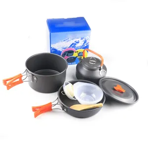 Outdoor camping cookware set details showing portable pots, folding handles, and kettle accessories.
