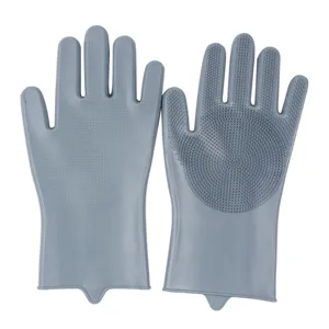 Detailed view of grey silicone cleaning gloves with dense scrubbing bristles for kitchen use.