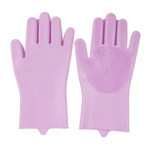 Pink silicone dishwashing gloves close-up view, double-sided scrubbing brushes for kitchen cleaning.