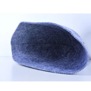 Grey felt sauna hat for bath and spa relaxation, soft absorbent hair drying cap detail view.