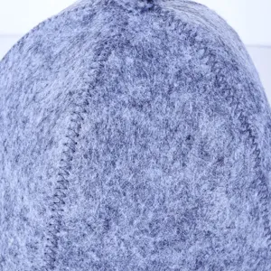 Detailed view of grey wool felt sauna hat, showing fine texture and strong stitching lines.