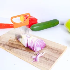 Stainless steel onion holder detail, kitchen tool for cutting vegetables and meat tenderizing.