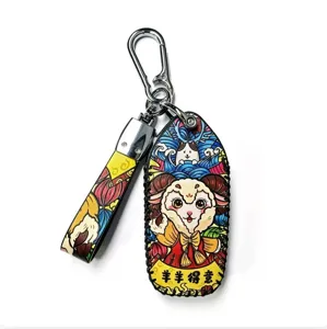 Detailed view of Chinese style zodiac sheep leather car keychain bag charm pendant accessory.