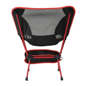 Back view detail of portable outdoor folding camping moon chair with red aluminum frame mesh back.