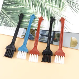 Mini plastic keyboard cleaning brush detail view, multi-purpose small tool for deep dust removal.