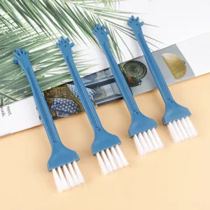 Mini plastic keyboard cleaning brush set with white bristles and cute hand handle design.