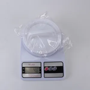 Plastic burger press and electronic kitchen scale detail view for easy patty making.