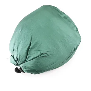 Detailed view of the portable outdoor parachute fabric camping hammock packed in storage bag.