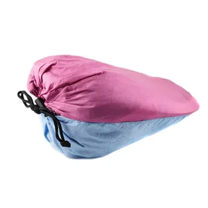 Portable dual-color hammock storage bag detail view, lightweight parachute cloth material.