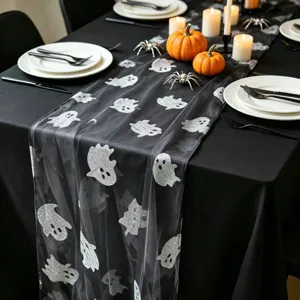 Halloween black mesh table runner with silver glitter ghost pattern for party decor.