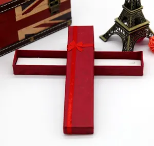 Long red paper gift box with ribbon bow, ideal for necklace bracelet jewelry packaging detail.