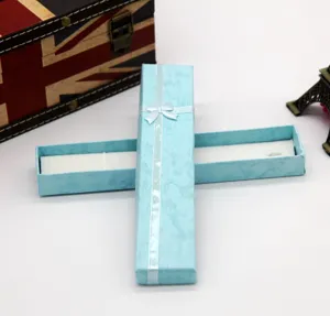 Light blue long gift box with white ribbon bow, elegant jewelry and necklace packaging box.