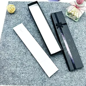 Long paper gift box detail showcasing jewelry packaging structure and elegant black white design.