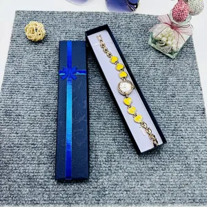 Elegant yellow heart design wrist watch packaged in a stylish long blue gift box.