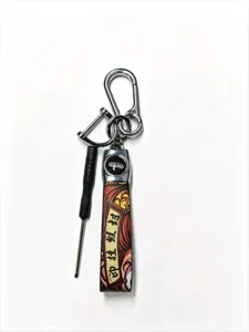Chinese style car keychain with metal hook, mini screwdriver and decorative strap detail.