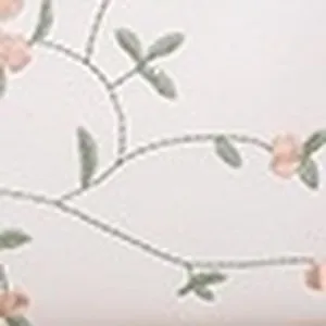 Close-up detail of exquisite floral and vine embroidery on soft fabric surface of the bag.