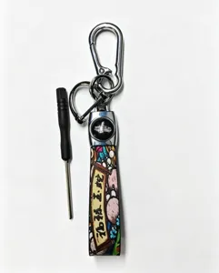 Metal car keychain with strap and mini screwdriver tool, detailed view showing the hook.