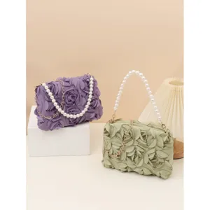 3D rose flower handbag with pearl chain strap, elegant petal design crossbody bag for daily wear.