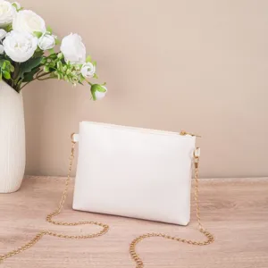 Minimalist white shoulder bag with gold chain strap, stylish chic crossbody handbag for women.