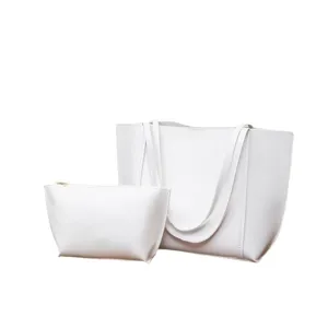 Minimalist white tote bag with matching pouch, stylish large capacity leather shoulder bag for women.