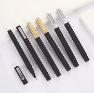 Detailed view of square plastic ballpoint pens featuring black bodies and colorful clips.